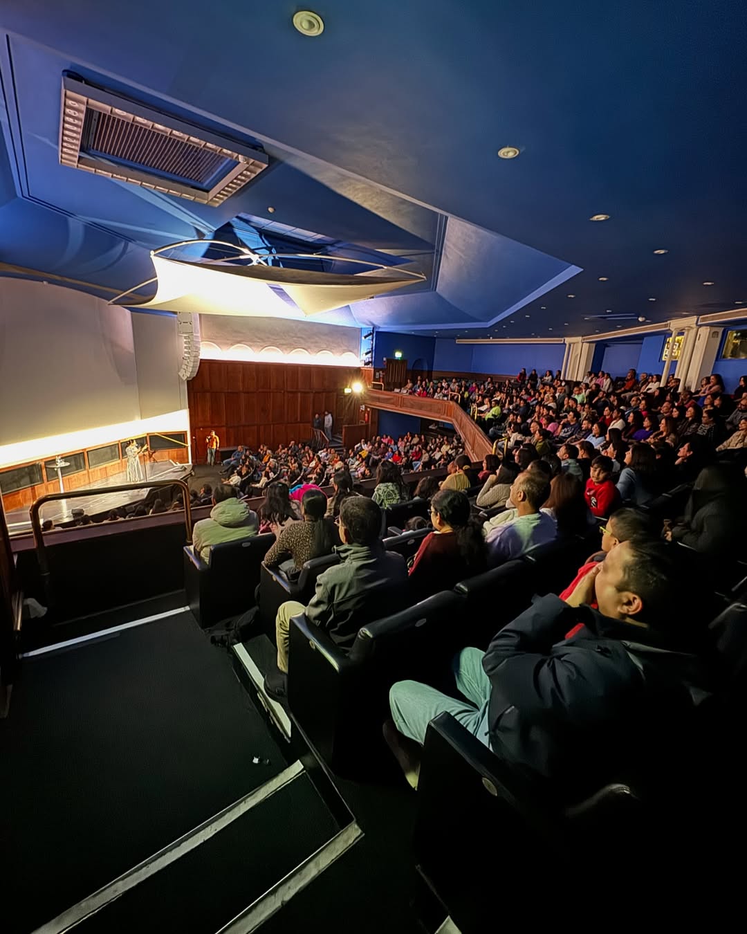 Comedy show audience laughing