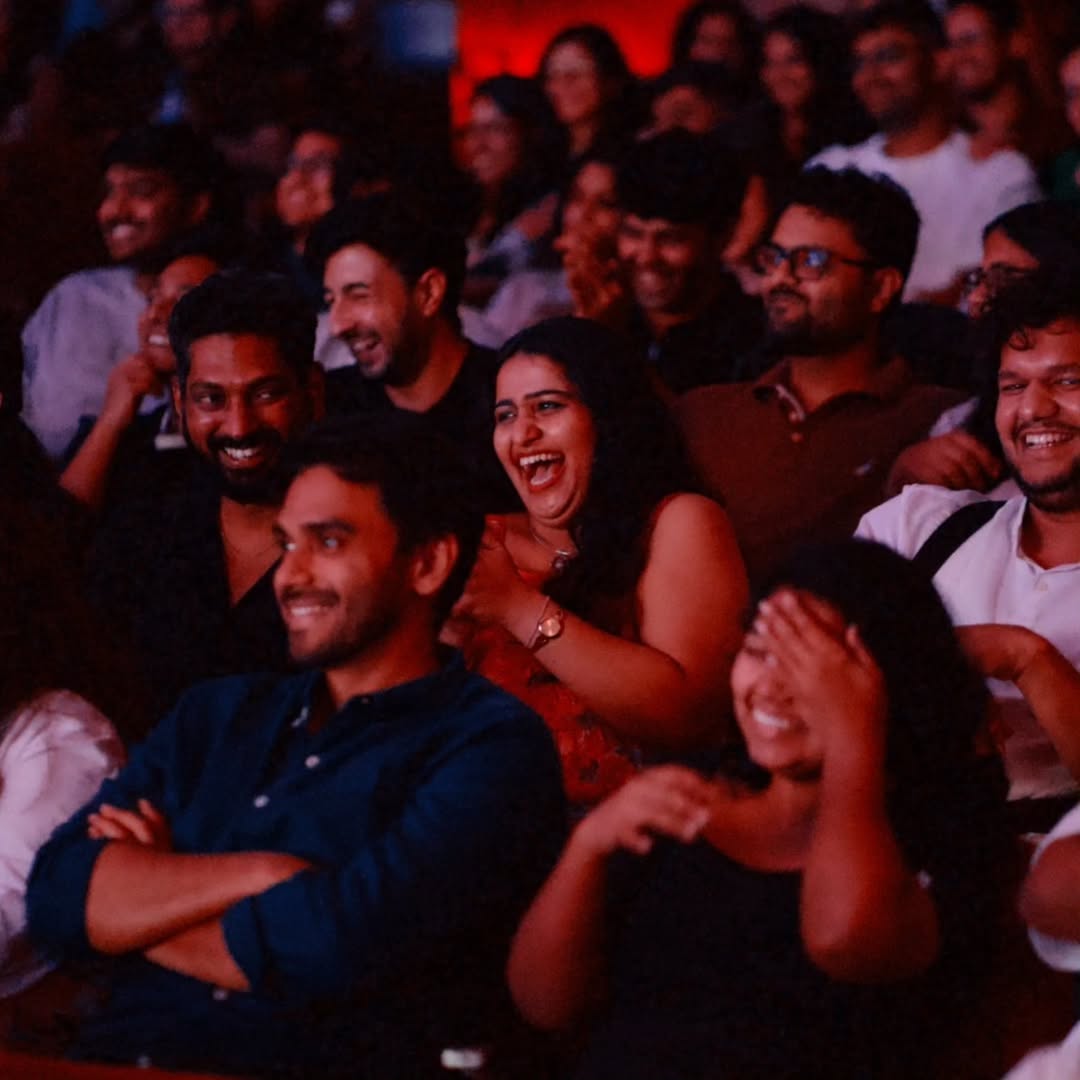 Spectators laughing in audience